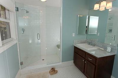 Master suite features a fully renovated bath with over-sized shower and marble top vanity.