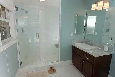 Master suite features a fully renovated bath with over-sized shower and marble top vanity.