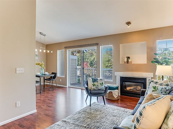 Top floor end unit features cozy gas fireplace.>
