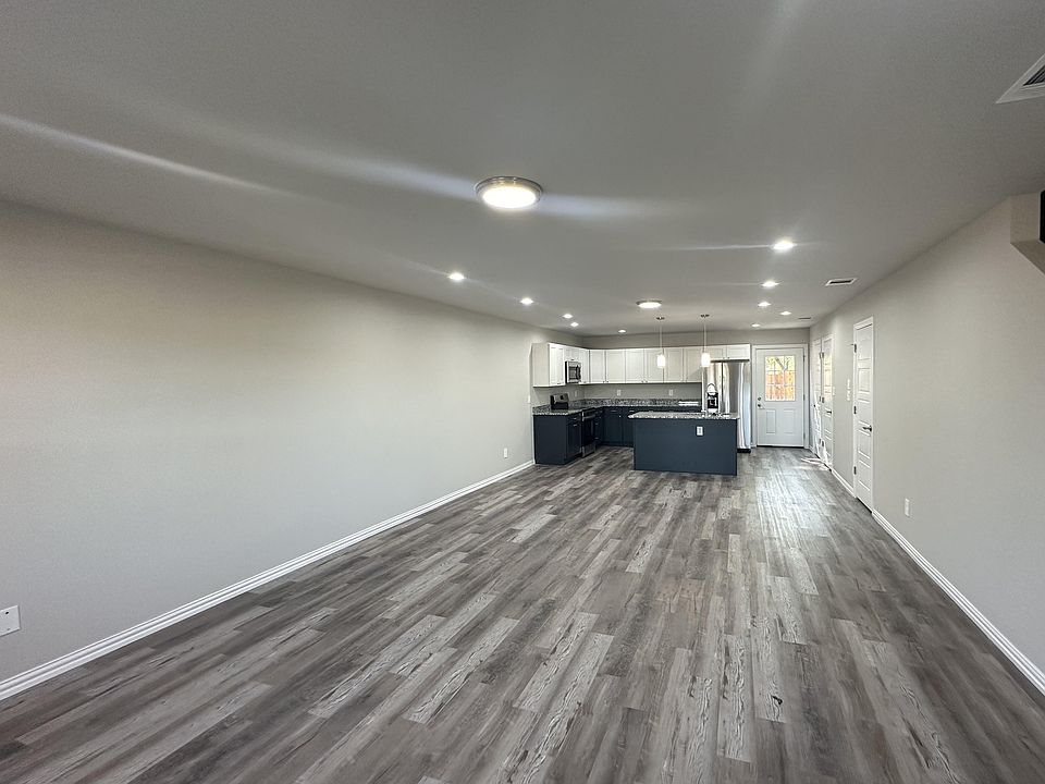 Stainless steel kitchen with fridge/freezer (filtered ice/water), stove, oven, microwave, dishwasher & disposal. Features a large island, tons of cabinets/counters, plus a walk-in pantry and a separate walk-in storage closet next to it!