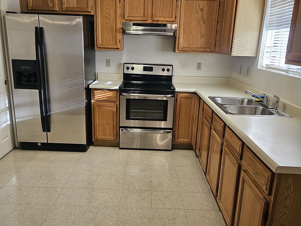 Nice kitchen appliances with new sink and faucet