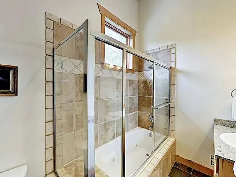 attached bathroom with second bedroom also