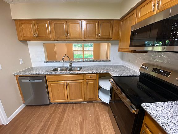 Cabinets feature a cleverly placed Lazy Susan!