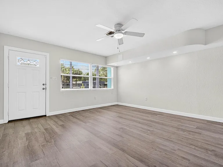 large living room with ceiling fan