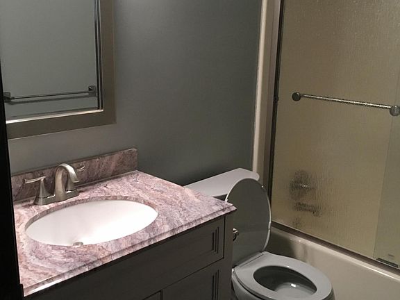 Bathroom 2nd floor new vanity toilet, shower doors , new flo