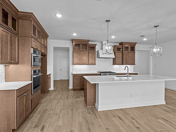 Kitchen with quartz countertops and island