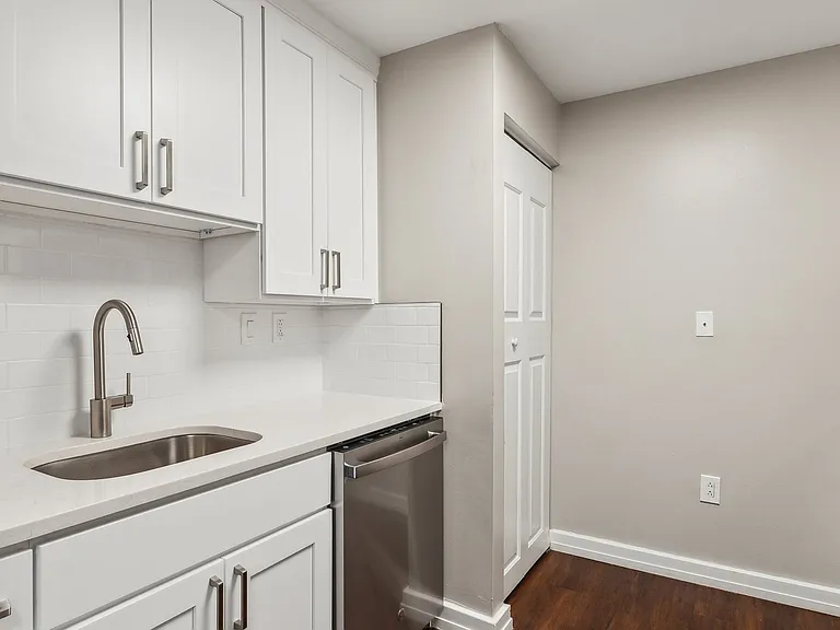 Updated kitchens with white quartz countertops, soft-close designer cabinetry and stainless steel appliances