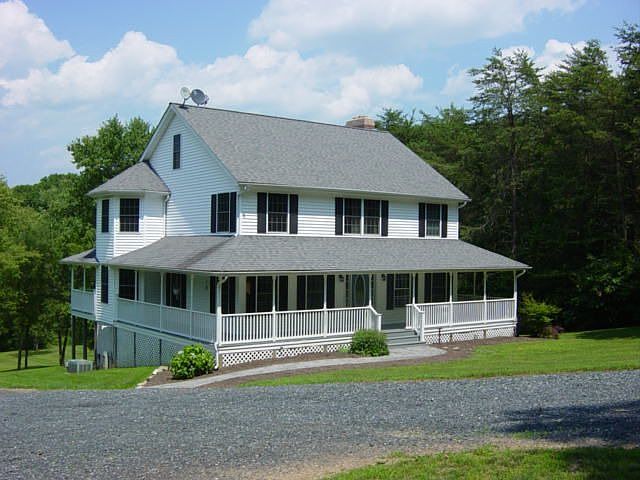 Colonial w/wrap around porch on 11.31 acres