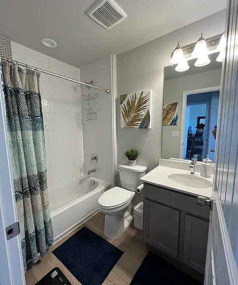 Upstairs 2nd full bathroom with custom shower tile