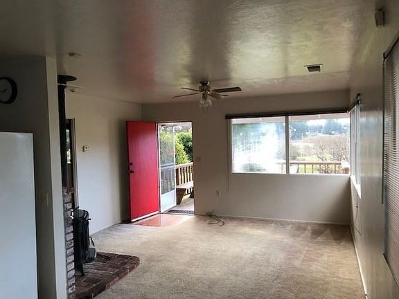 Looking from kitchen to front door and porch.
