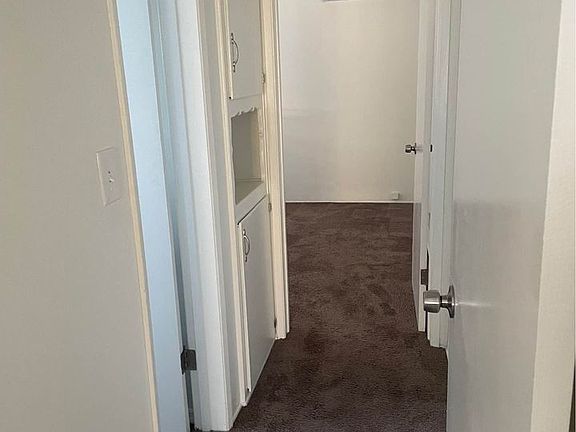 Hallway -bathroom right, storage area, and bedroom straight