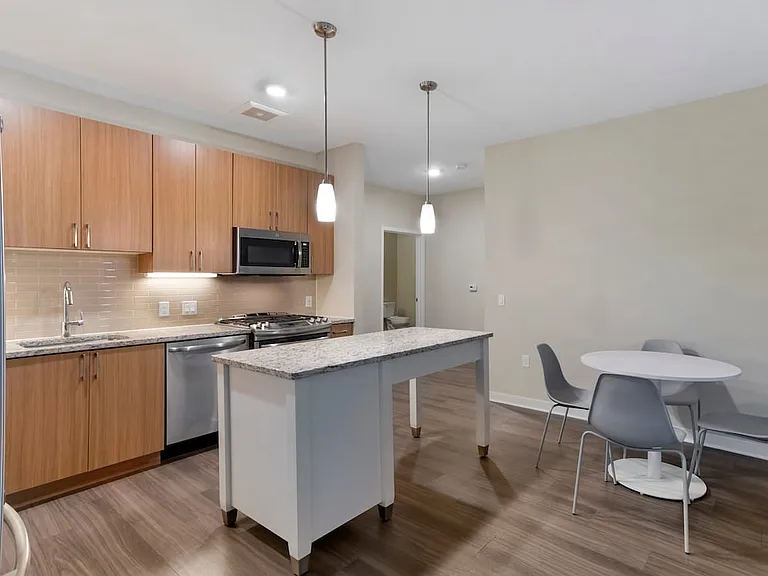 Furnished+ apartment homes include a dining set (Representative Image exact items and style of furnishings may vary)