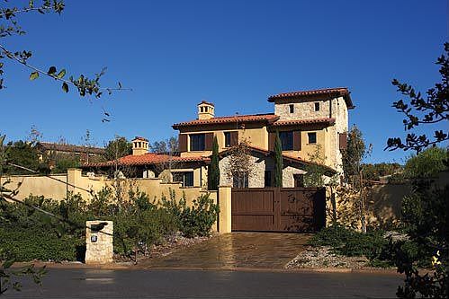 Private 28,924 sq.ft. corner lot location with long gated motorcourt driveway.
