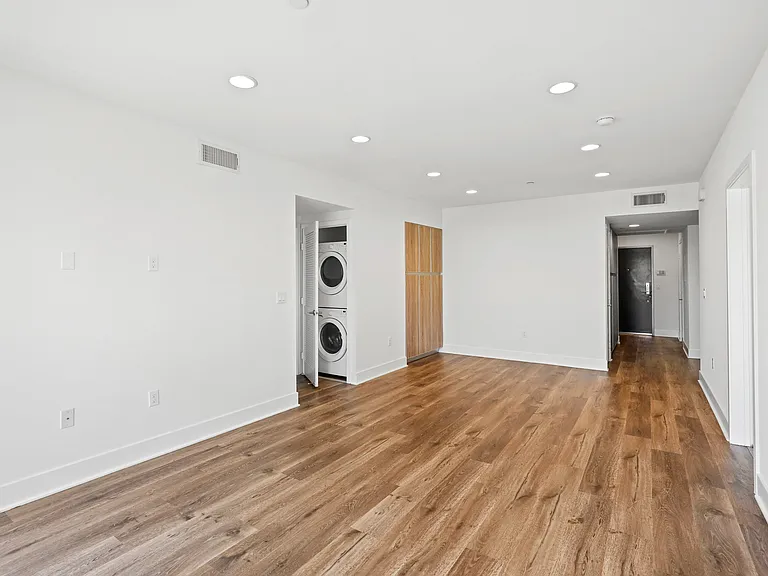 Living Room with Vinyl Flooring and In-Suite Washer & Dryer