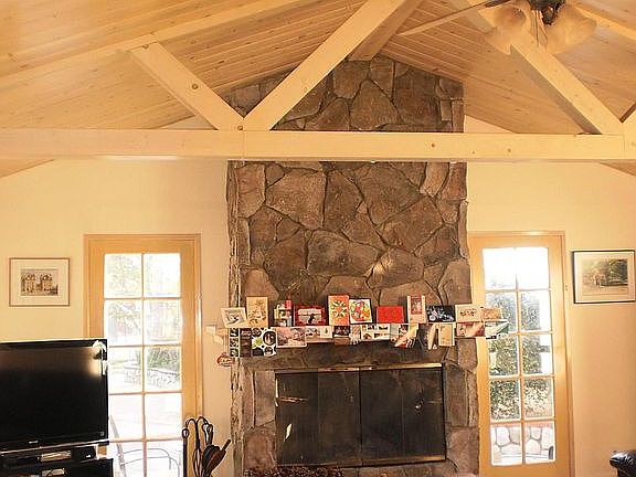 Family room - hige fireplace, exposed wood beams