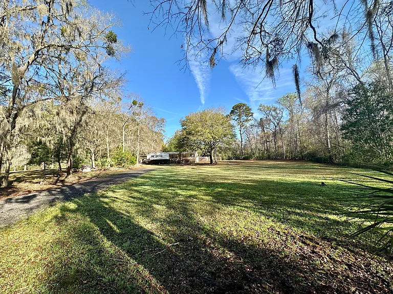 Approach from the driveway. Plenty of yard space. Very quiet and peaceful.