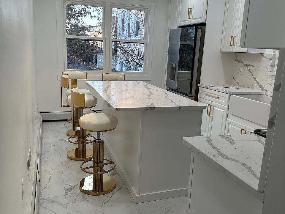 Totally renovated ultra modern kitchen,quartz countertops, large island with four bar stools, great place for cooking and entertaining. All new appliances, tons of cabinet space, completely private- no neighbors can see you!