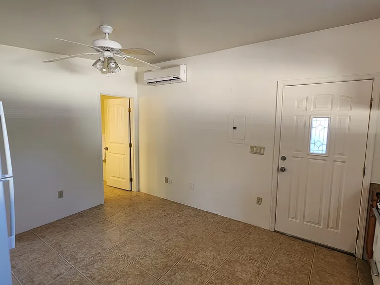 Entry Door on the Right and Bathroom Door on the Left