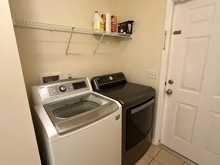 HE washer and dryer in laundry room