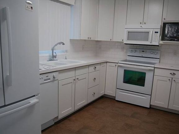 New kitchen includes new cabinets, new floors and new Whirpool appliances.