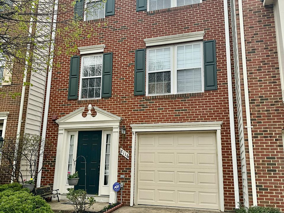 Welcoming front exterior featuring a private driveway, main entrance, and convenient access to the attached garage