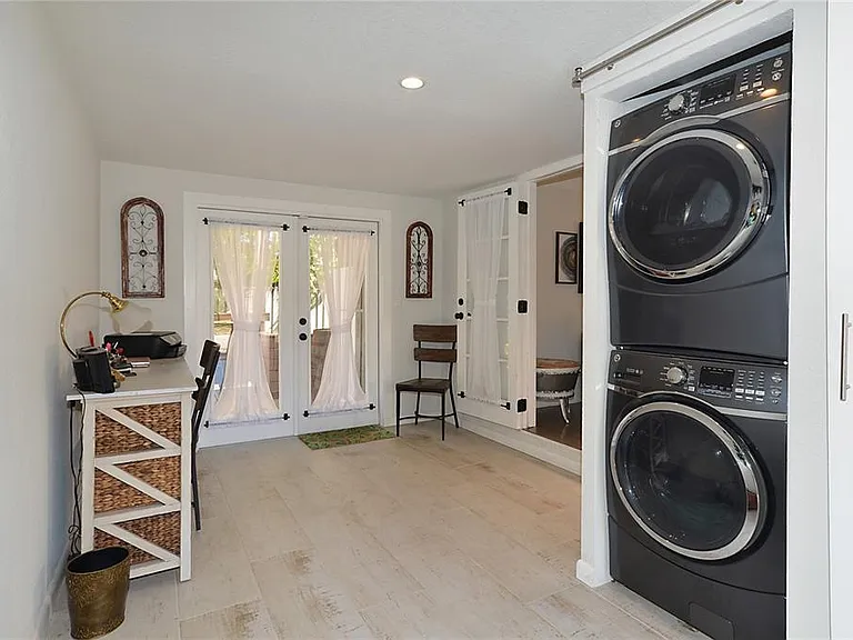 Bonus room with laundry closet (washer and dryer included with rent) and French doors leading to backyard