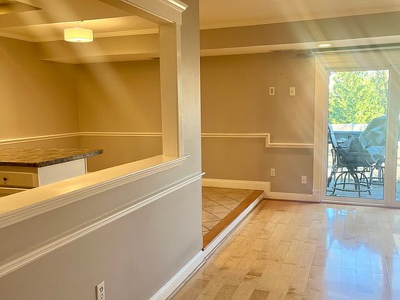 This rental is unfurnished - open living room/kitchen and dining area. Small private deck off of living room.