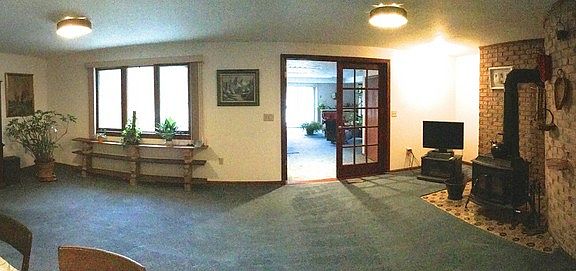 View from the Kitchen : From the kitchen you can see the family room, outside deck and bonus room.
