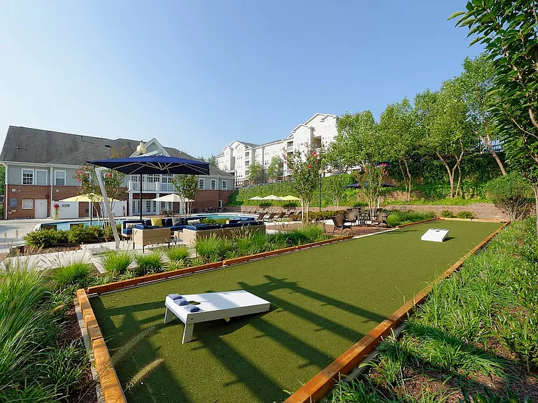 Courtyard with swimming pool, sundeck, lounge seating and outdoor gaming area