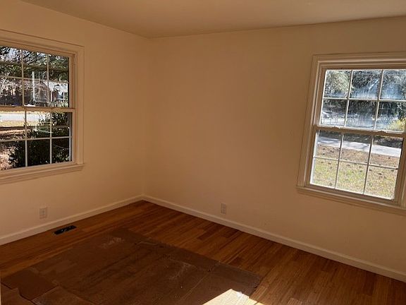Beautiful light through the front bedroom windows onto bamboo floors throughout. New curtain rods will be up throughout the house.