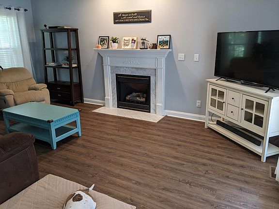 The flooring in this picture is throughout the entire first floor.