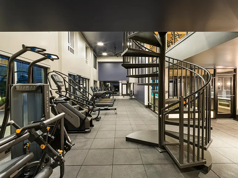 The two-story fitness center at Modera Beaverton offers ample space and premium equipment for every workout style.