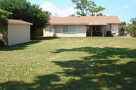 Back view of home w shed
