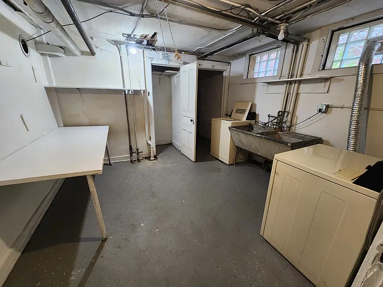 Basement lower unit laundry room