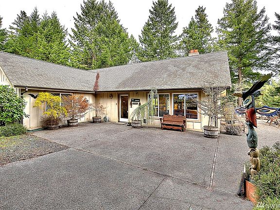 Charming main home features expansive wrap around patio, 3 bedrooms, and 1.75 baths. 