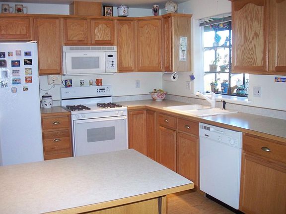 Kitchen has lots of cupboard space, plus an island for your workstation or cooking prep.