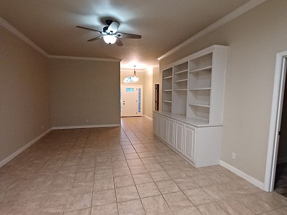 Looking back to the front door from the fireplace.