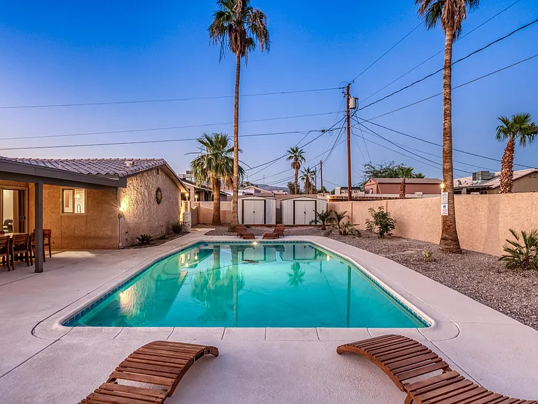 Private backyard retreat with ample deck space for lounging and entertaining.