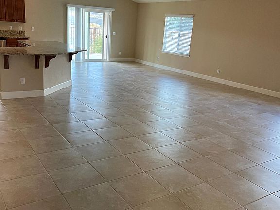 Great room with dining, slider to backyard