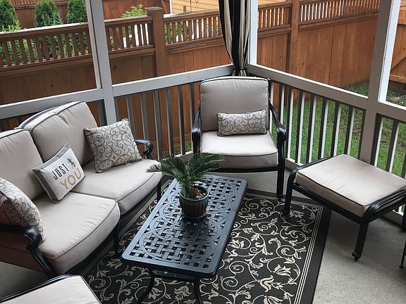 screened porch next to kitchen
