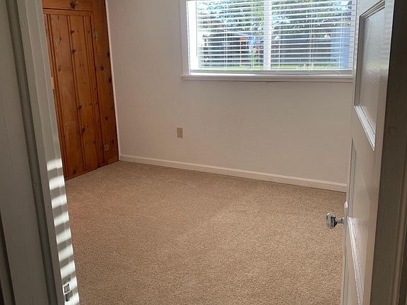 Front bedroom off living room with 2 large windows