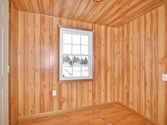 The foyer is spacious and can be used many different ways. A bench and coat hooks would make a great addition for the family. 