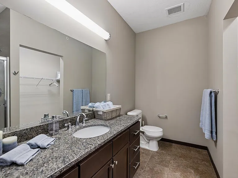 Spacious bathrooms make everyday routines feel organized and relaxed, with thoughtful room to get ready and reset.