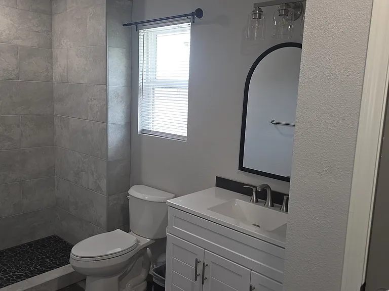 Full size shower , with 36 inch cabinet sink .
