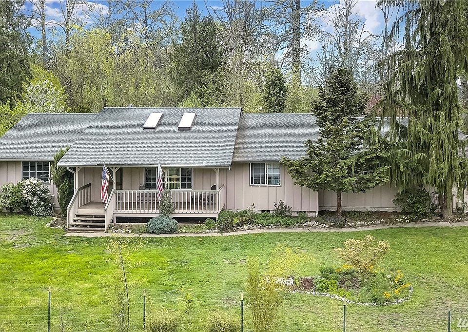 Front of home - large fenced-in yard front & back. 