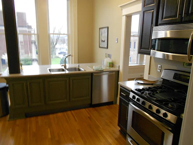 Gas stove, with 5 burners and/or griddle. Warming drawer below oven. Bosch dishwasher.