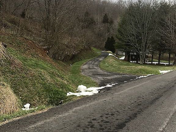 main road, driveway to left
