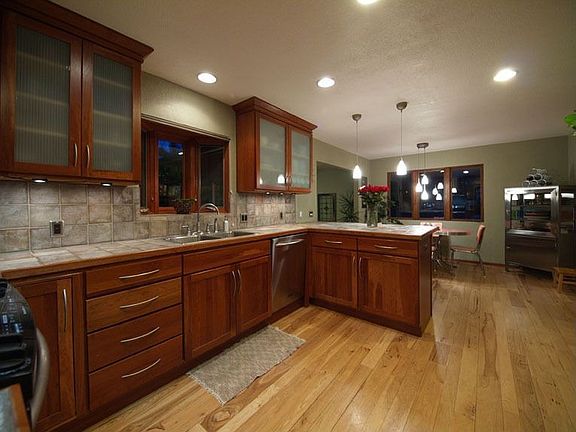 HARDWOOD FLOORS EXTEND THRU KITCHEN, NOOK AND DINING ROOM