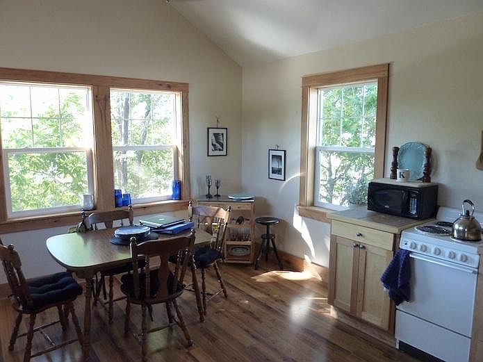 Kitchen/dining shown furnished.