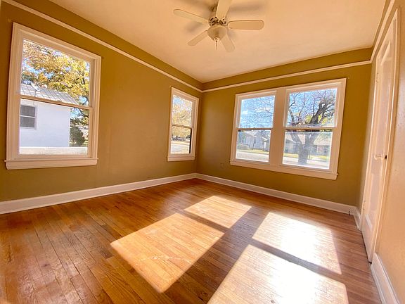 bedroom 2 with hardwood floors and spacious closet